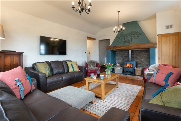 The first floor living room in Croft House with log burner